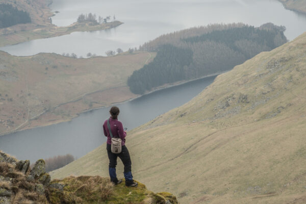 Harriet making notes on crags below Little Harter Fell with Haweswater beyond